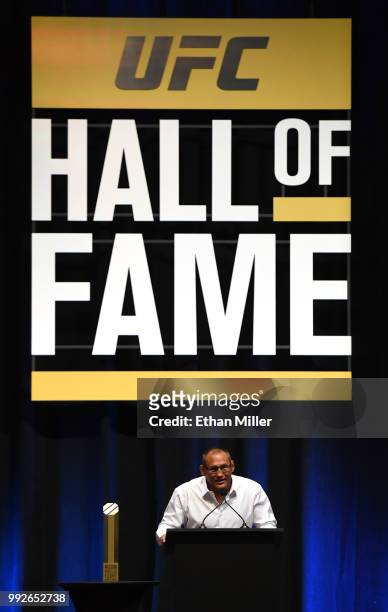 Former mixed martial artist Dan Henderson speaks as his 2011 fight against Mauricio "Shogun" Rua in UFC 139 is inducted into the UFC Hall of Fame at...