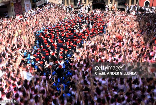 The "Pamplonesa" municipal music band performs during the 'Chupinazo' to mark the kickoff at noon sharp of the San Fermin Festival, in front of the...
