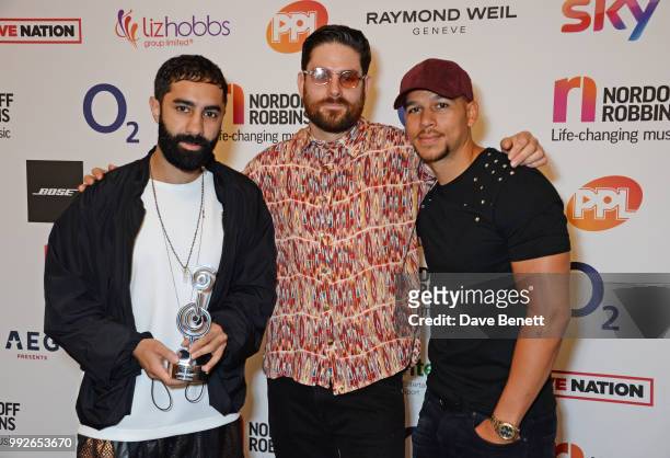 Amir Amor, Piers Agget and Kesi Dryden of Rudimental attend the Nordoff Robbins O2 Silver Clef Awards at The Grosvenor House Hotel on July 6, 2018 in...