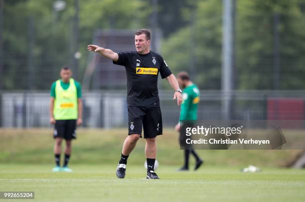 Headcoach Dieter Hecking gives instructions during a training session of Borussia Moenchengladbach at Borussia-Park on July 05, 2018 in...