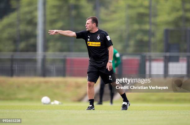 Headcoach Dieter Hecking gives instructions during a training session of Borussia Moenchengladbach at Borussia-Park on July 05, 2018 in...