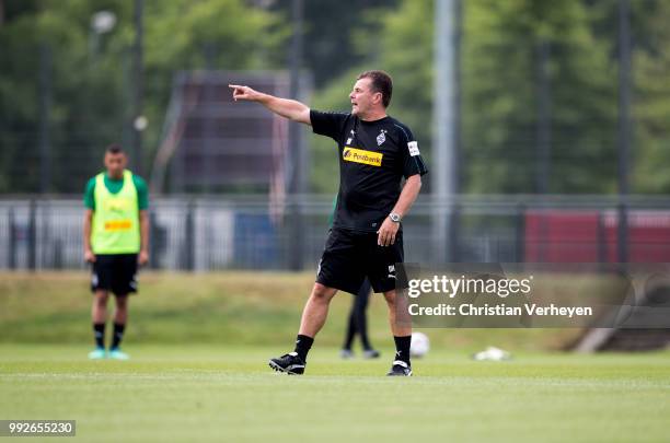 Headcoach Dieter Hecking gives instructions during a training session of Borussia Moenchengladbach at Borussia-Park on July 05, 2018 in...