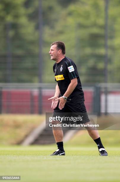 Headcoach Dieter Hecking gives instructions during a training session of Borussia Moenchengladbach at Borussia-Park on July 05, 2018 in...