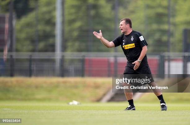 Headcoach Dieter Hecking gives instructions during a training session of Borussia Moenchengladbach at Borussia-Park on July 05, 2018 in...