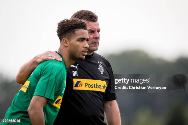 Keanan Bennetts and Headcoach Dieter Hecking during a training session of Borussia Moenchengladbach at Borussia-Park on July 05, 2018 in...