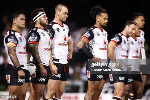 Simon Mannering of the Warriors and his team mates look dejected after a Panthers try during the round 17 NRL match between the Penrith Panthers and...