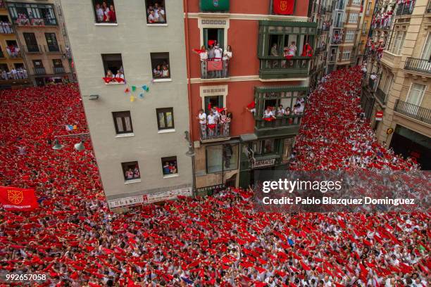 Revellers enjoy the atmosphere during the opening day or 'Chupinazo' of the San Fermin Running of the Bulls fiesta on July 6, 2018 in Pamplona,...