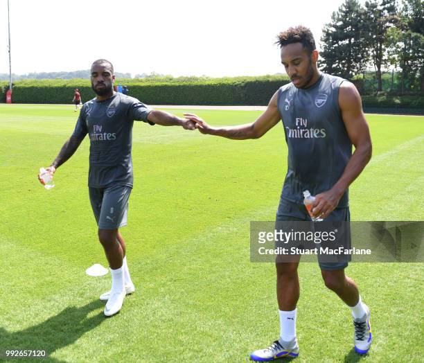 Alex Lacazette and Pierre-Emerick Aubameyang of Arsenal during a training session at London Colney on July 6, 2018 in St Albans, England.