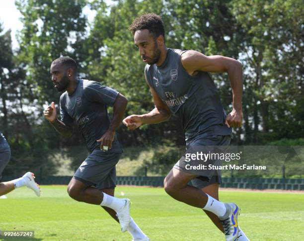 Alex Lacazette and Pierre-Emerick Aubameyang of Arsenal during a training session at London Colney on July 6, 2018 in St Albans, England.