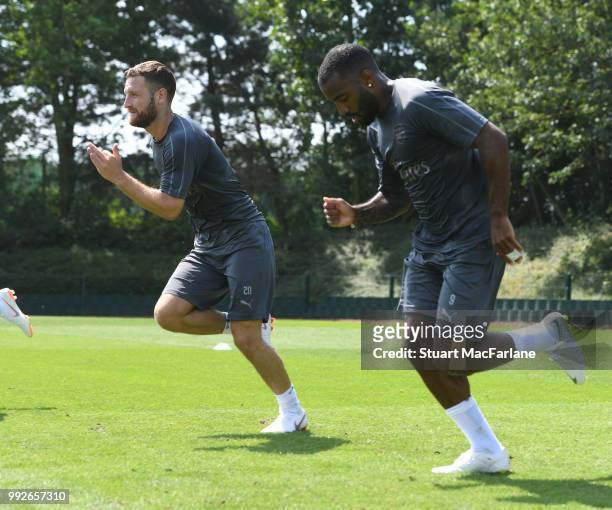 Shkodran Mustafi and Alex Lacazette of Arsenal during a training session at London Colney on July 6, 2018 in St Albans, England.