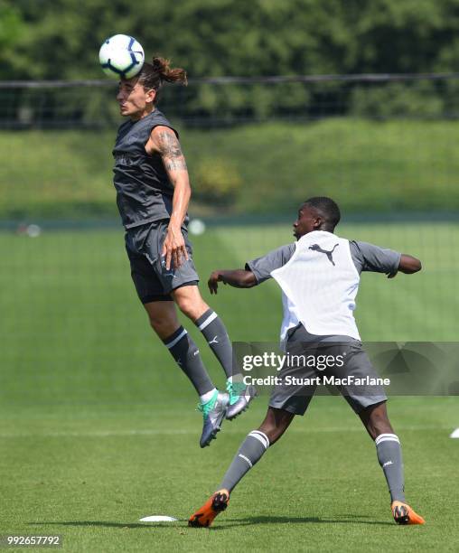 Hector Bellerin and Eddie Nketiah of Arsenal during a training session at London Colney on July 6, 2018 in St Albans, England.