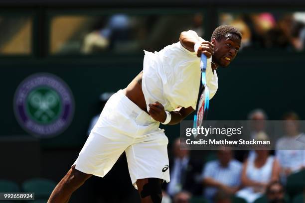 Gael Monfils of France serves against Sam Querrey of the United States during their Men's Singles third round match on day five of the Wimbledon Lawn...