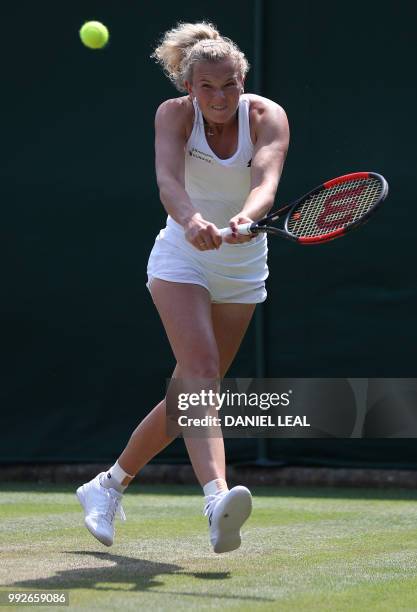 Czech Republic's Katerina Siniakova returns against Italy's Camila Giorgi during their women's singles third round match on the fifth day of the 2018...
