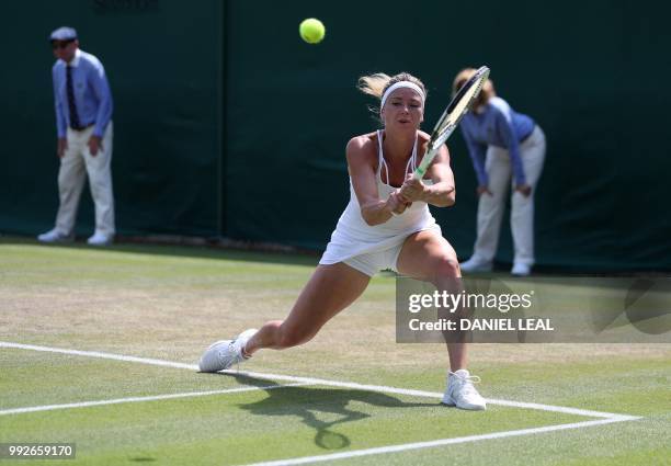 Italy's Camila Giorgi returns against Czech Republic's Katerina Siniakova during their women's singles third round match on the fifth day of the 2018...