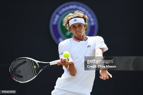 Alexander Zverev of Germany returns a shot against Taylor Fritz of the United States duirng their Men's Singles second round match on day five of the...