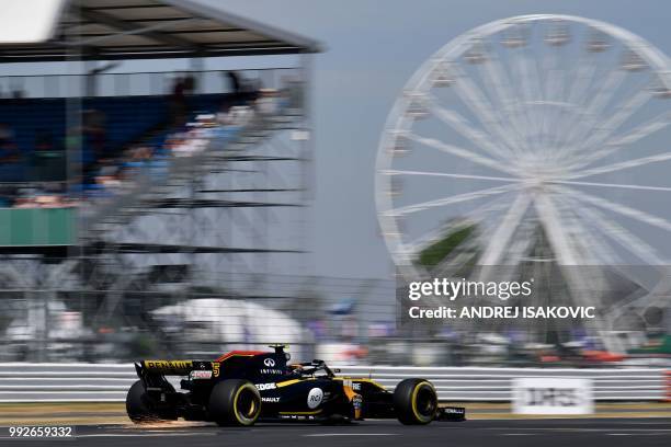 Renault's Spanish driver Carlos Sainz Jr drives during first practice at Silverstone motor racing circuit in Silverstone, central England, on July 6,...