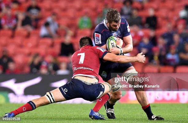 Geoff Parling of the Rebels takes on the defence during the round 18 Super Rugby match between the Reds and the Rebels at Suncorp Stadium on July 6,...