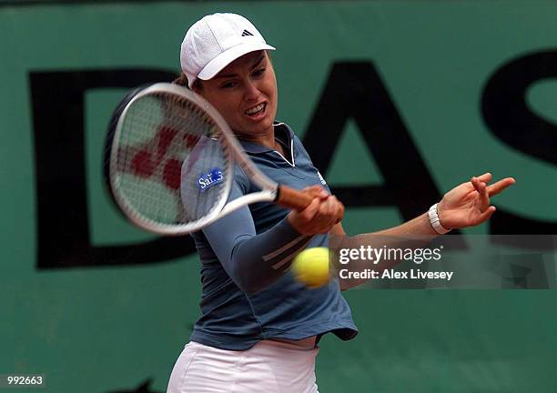 Martina Hingis of Switzerland returns in her Quarter final match against Francesca Schiavone of Italy during the French Open Tennis at Roland Garros,...