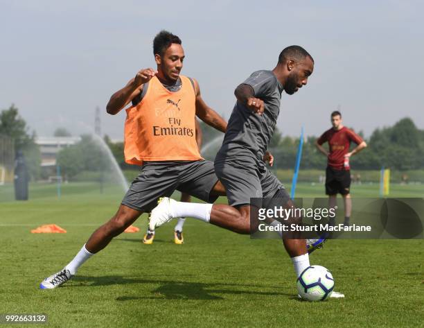 Pierre-Emerick Aubameyang and Alex Lacazette of Arsenal during a training session at London Colney on July 6, 2018 in St Albans, England.