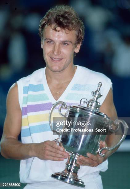 Mats Wilander of Sweden poses with the trophy after defeating Ivan Lendl of Czechoslovakia in the Men's Singles Final of the US Open at the USTA...