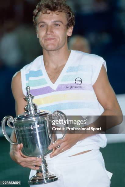 Mats Wilander of Sweden poses with the trophy after defeating Ivan Lendl of Czechoslovakia in the Men's Singles Final of the US Open at the USTA...