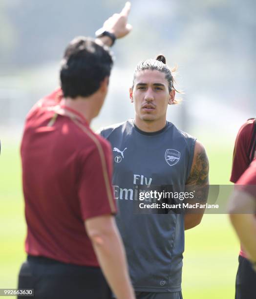 Arsenal Head Coach Unai Emery talkes to Hector Bellerin during a training session at London Colney on July 6, 2018 in St Albans, England.