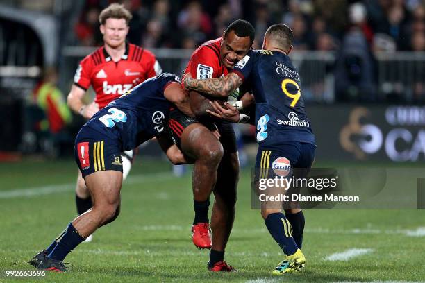 Manasa Mataele of the Crusaders is tackled by Aaron Smith of the Highlanders during the round 18 Super Rugby match between the Crusaders and the...