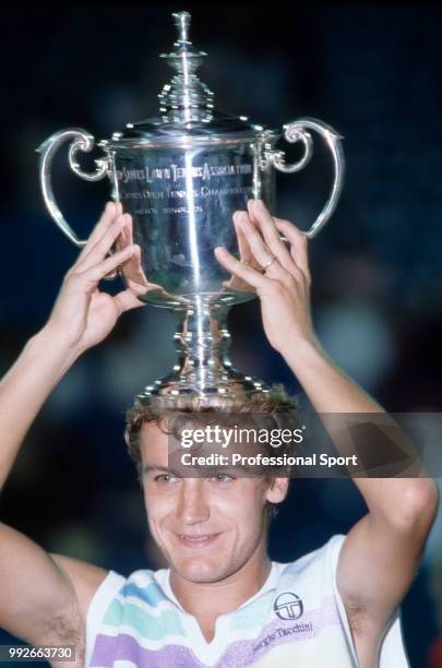 Mats Wilander of Sweden lifts the trophy after defeating Ivan Lendl of Czechoslovakia in the Men's Singles Final of the US Open at the USTA National...