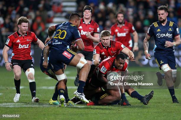 Manasa Mataele of the Crusaders is tackled during the round 18 Super Rugby match between the Crusaders and the Highlanders at AMI Stadium on July 6,...