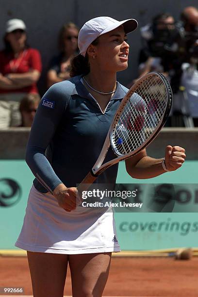 Martina Hingis of Switzerland celebrates after winning her Quarter final match against Francesca Schiavone of Italy during the French Open Tennis at...