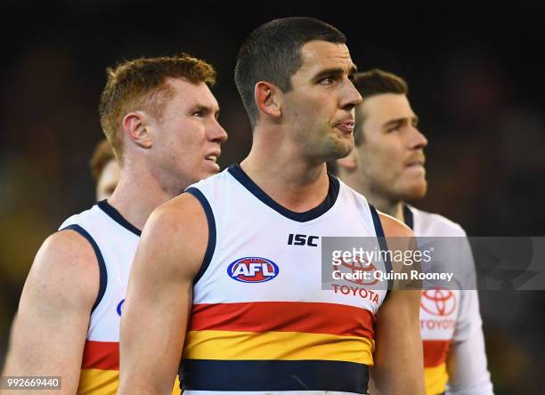Tom Lynch and Taylor Walker of the Crows look dejected after losing the round 16 AFL match between the Richmond Tigers and the Adelaide Crows at...