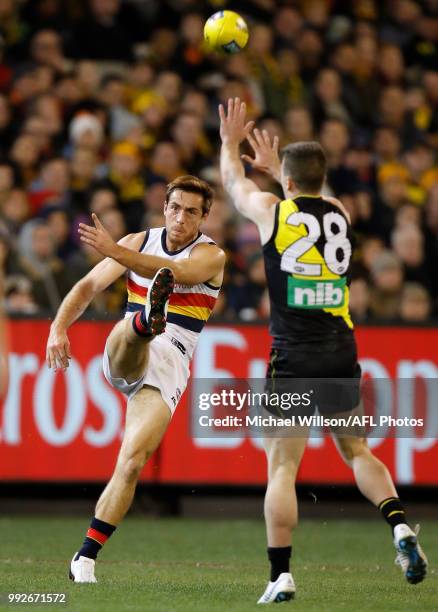 Richard Douglas of the Crows kicks the ball during the 2018 AFL round 16 match between the Richmond Tigers and the Adelaide Crows at the Melbourne...