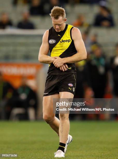 Jack Riewoldt of the Tigers holds his arm during the 2018 AFL round 16 match between the Richmond Tigers and the Adelaide Crows at the Melbourne...