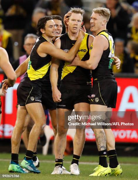 Daniel Rioli, Jack Riewoldt and Josh Caddy of the Tigers celebrate during the 2018 AFL round 16 match between the Richmond Tigers and the Adelaide...