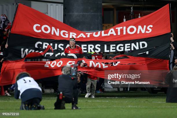 Wyatt Crockett, the most capped player in Super Rugby history, runs out onto the field for his 200th appearance for the Crusaders ahead of the round...