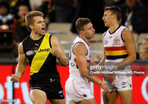 Dan Butler of the Tigers celebrates a score during the 2018 AFL round 16 match between the Richmond Tigers and the Adelaide Crows at the Melbourne...