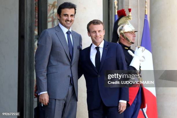 French president Emmanuel Macron welcomes Qatar Sheikh Tamim bin Hamad Al Thani at the Elysee palace on July 6 in Paris.