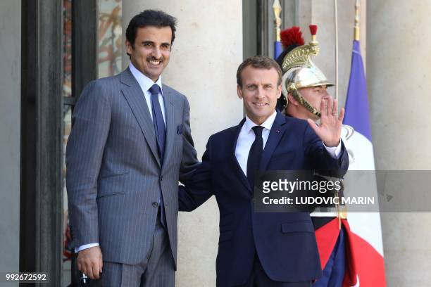French president Emmanuel Macron welcomes Qatar Sheikh Tamim bin Hamad Al Thani at the Elysee palace on July 6 in Paris.