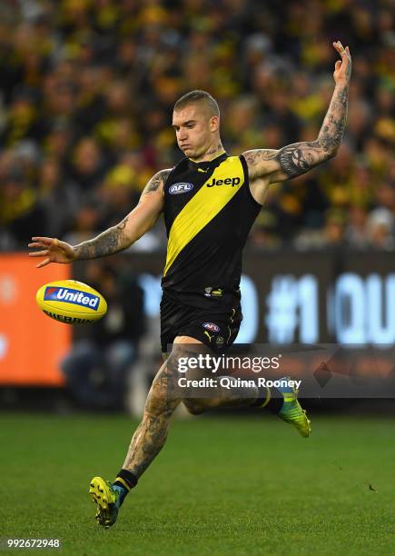 Dustin Martin of the Tigers kicks during the round 16 AFL match between the Richmond Tigers and the Adelaide Crows at Melbourne Cricket Ground on...