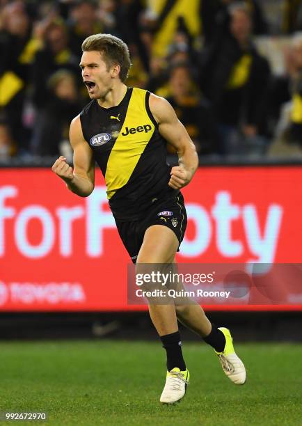 Dan Butler of the Tigers celebrates kicking a goal during the round 16 AFL match between the Richmond Tigers and the Adelaide Crows at Melbourne...