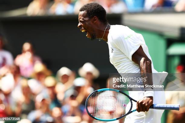 Gael Monfils of France celebrates winning the second set against Sam Querrey of the United States during their Men's Singles third round match on day...