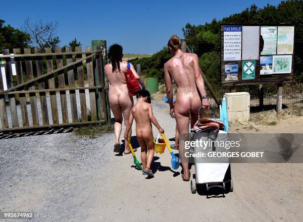 Graphic content / Naked people walk at the Arnaoutchot naturist camping on June 26, 2018 in Vielle-Saint-Girons, southwestern France. - According to...