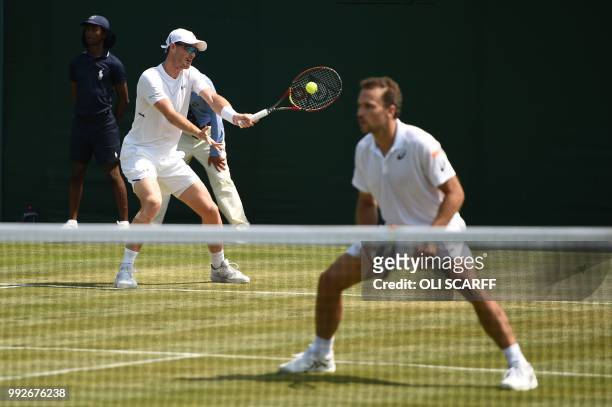 Britain's Jamie Murray and Brazil's Bruno Soares return to Italy's Paolo Lorenzi and Spain's Albert Ramos-Vinolas in their men's doubles first round...
