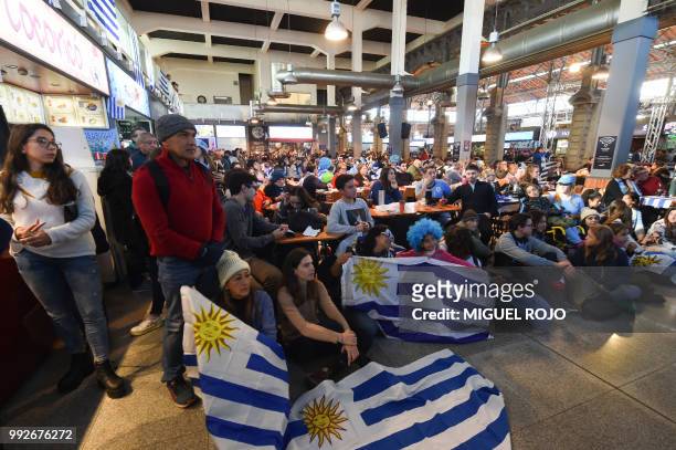 Fans of Uruguay attend the broadcasting of the Russia 2018 FIFA World Cup football match Uruguay against France on a big screen at the Mercado...