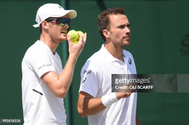 Britain's Jamie Murray and Brazil's Bruno Soares play against Italy's Paolo Lorenzi and Spain's Albert Ramos-Vinolas in their men's doubles first...