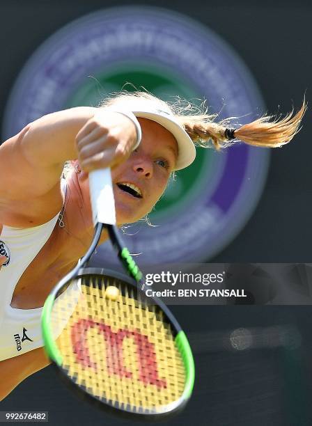 Netherlands' Kiki Bertens serves to US player Venus Williams during their women's singles third round match on the fifth day of the 2018 Wimbledon...