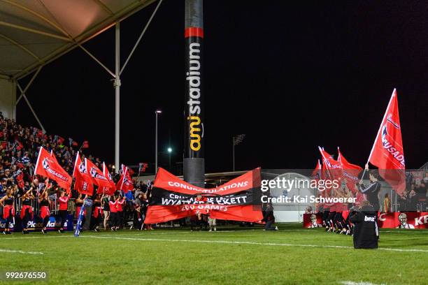 Wyatt Crockett of the Crusaders runs out for his 200th Super Rugby match prior to the round 18 Super Rugby match between the Crusaders and the...