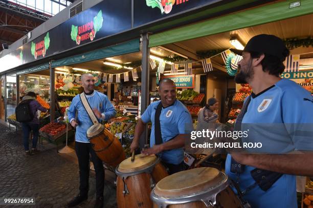 Fans of Uruguay attend the broadcasting of the Russia 2018 FIFA World Cup football match Uruguay against France on a big screen at the Mercado...