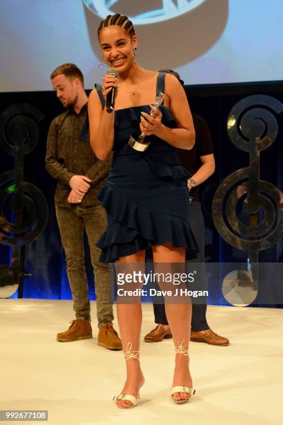 Presenter Maverick Sabre and Jorja Smith, winner of the Amazon Music Best Newcomer Award on stage during the Nordoff Robbins' O2 Silver Clef Awards...