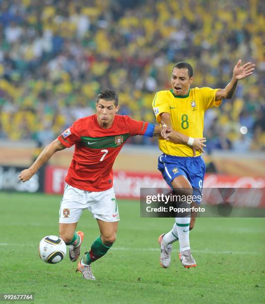 Gilberto Silva of Brazil challenges Cristiano Ronaldo of Portugal during a FIFA World Cup Group G match at the Moses Mabhida Stadium on June 25, 2010...